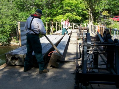 Manipulation of 12" wooden log at TSW dam
